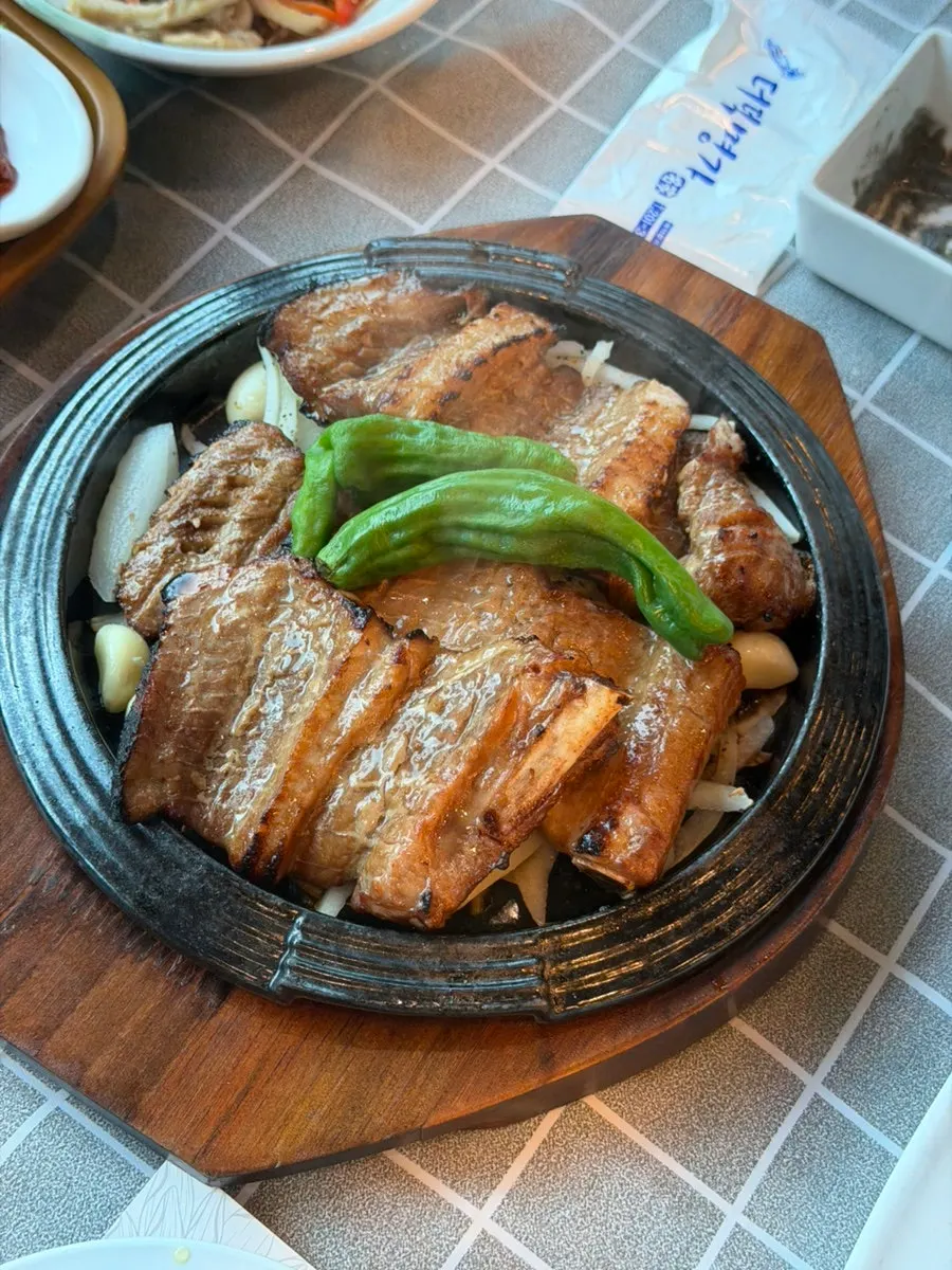 A generous portion of wood-fired pork galbi for two