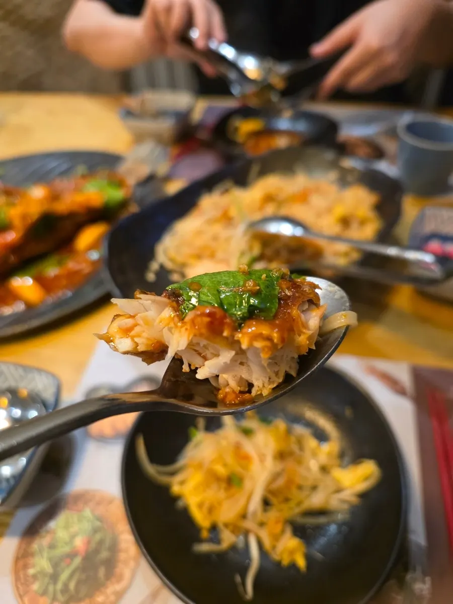 Plate of chili sea bass with pineapple mixed in