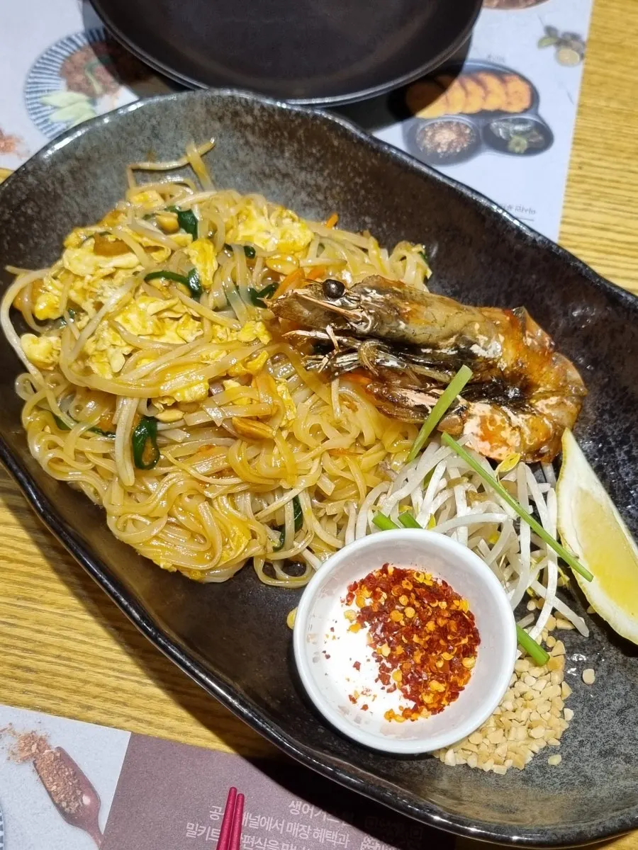Chewy pad thai noodles mixed with egg and seafood