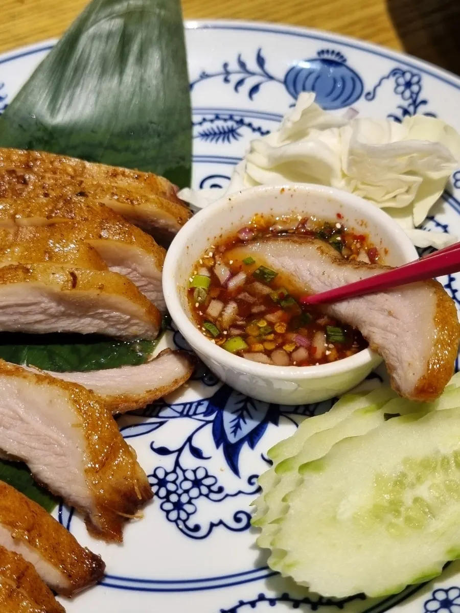 Khor moo yang plated with a Southeast Asian feel
