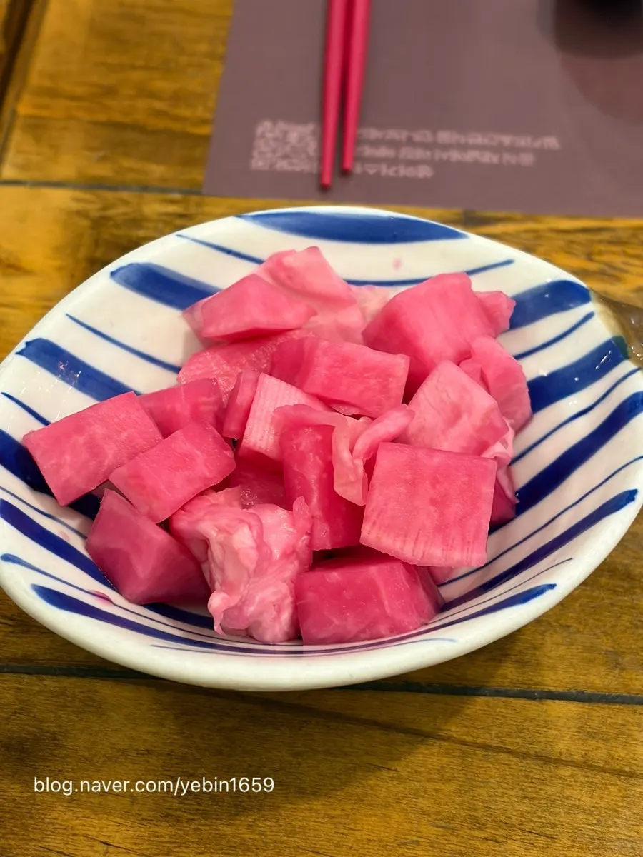 Pink pickles served as a side dish