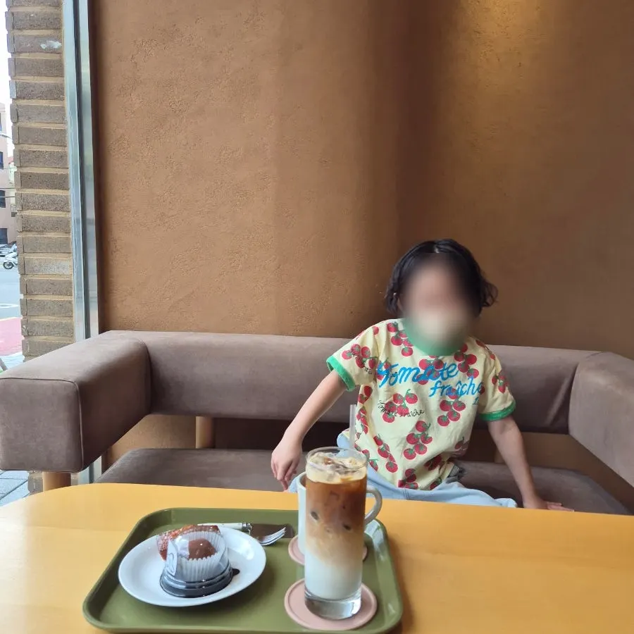 Child delighted by chocolate desserts