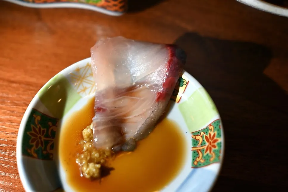 Thickly sliced white fish sashimi