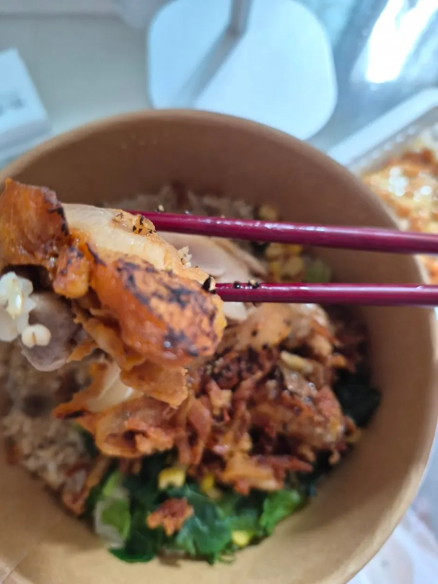 Rose onion whole chicken thigh bowl topped with chicken thigh
