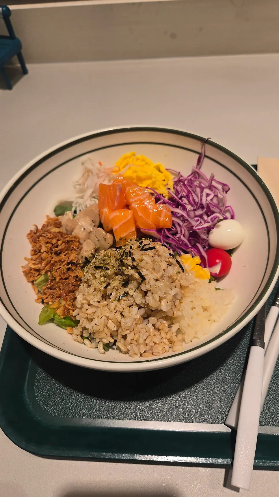 Raw salmon bibim poke packed into a ceramic bowl