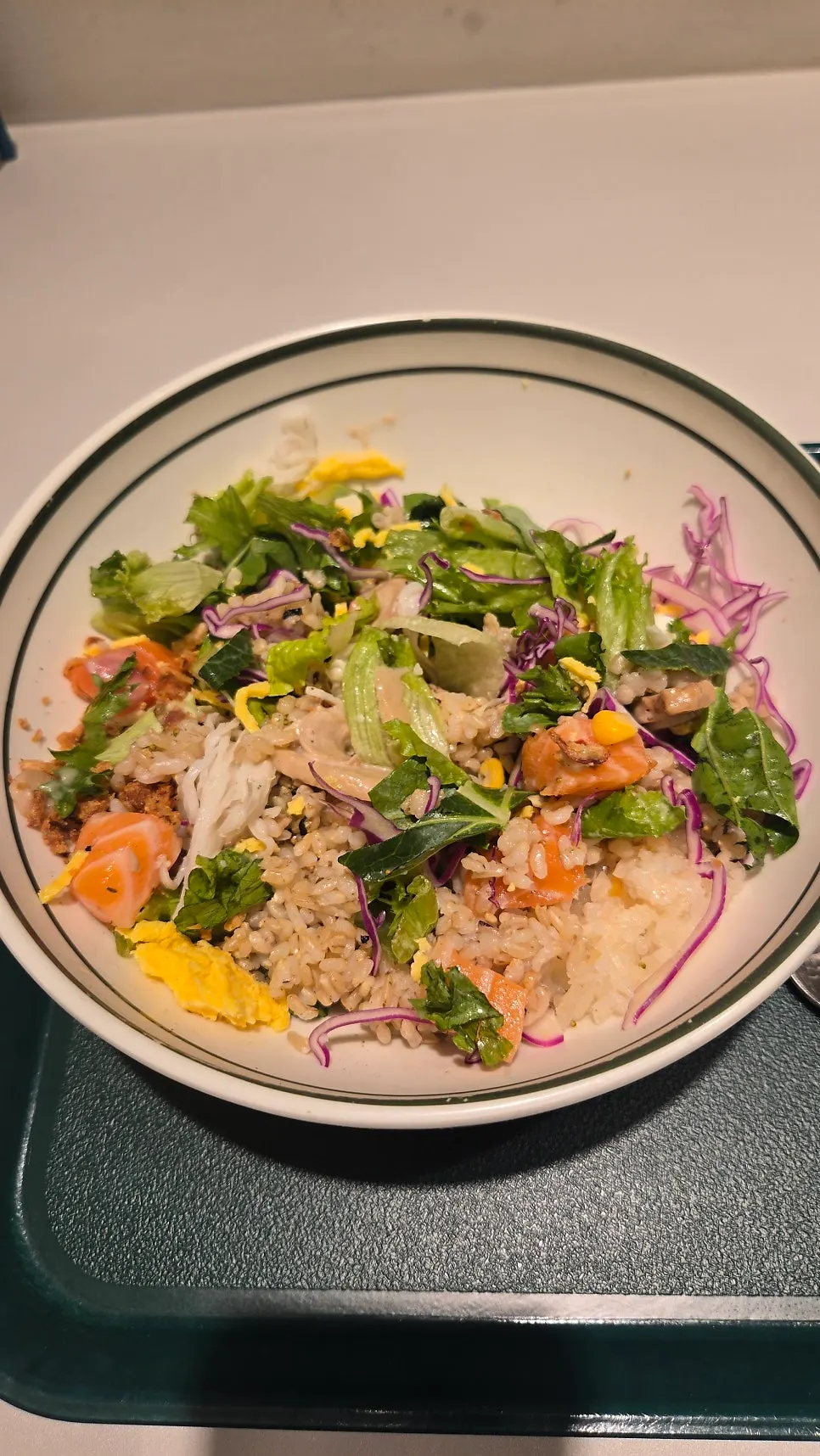 A spoonful of raw salmon bibim poke