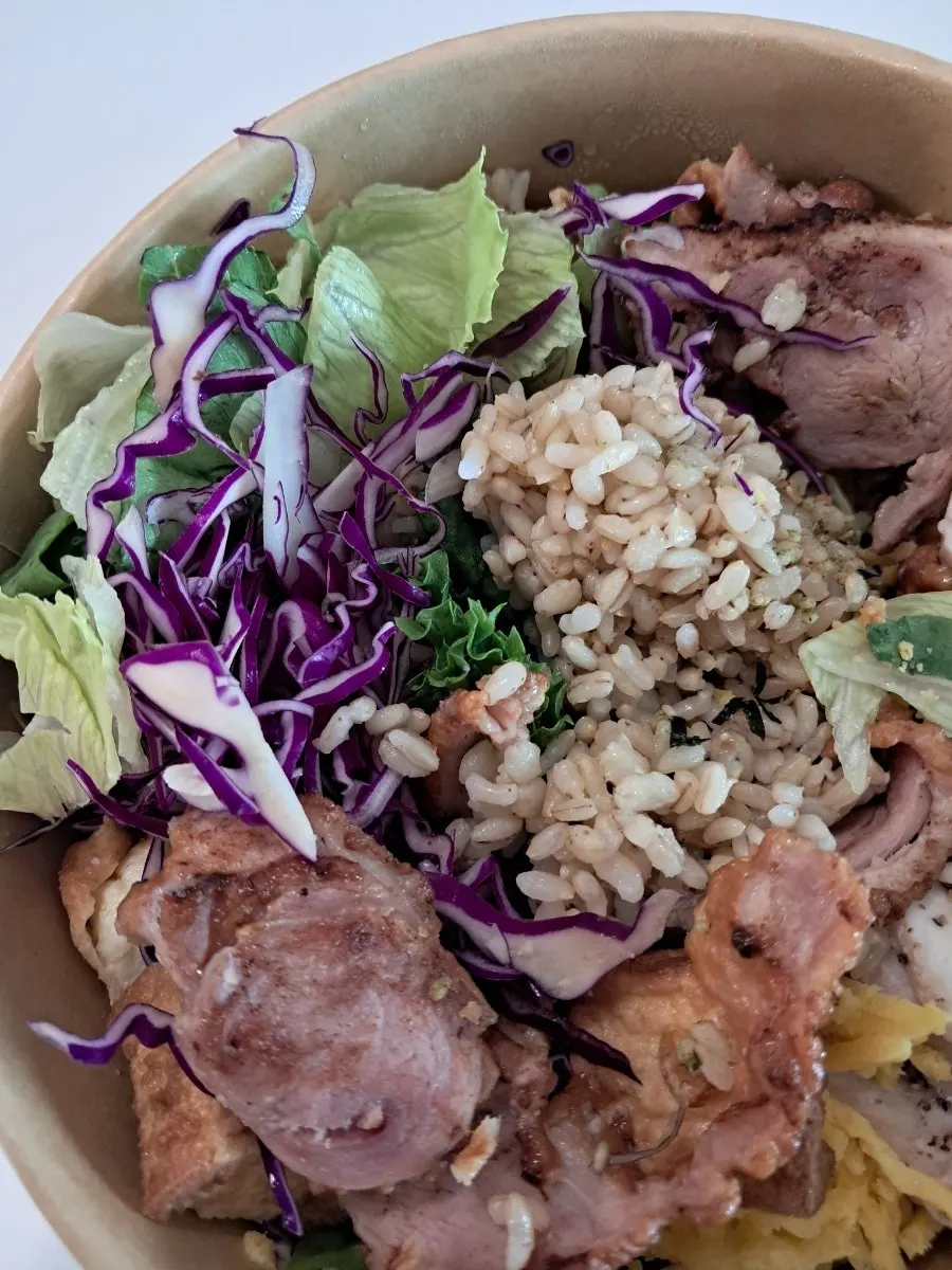 Brown rice and barley base underneath the bibim poke