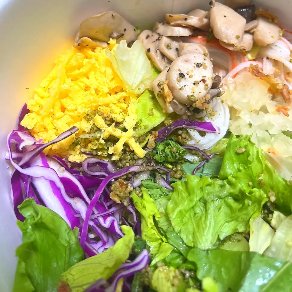 Close-up of egg strip and crab stick toppings