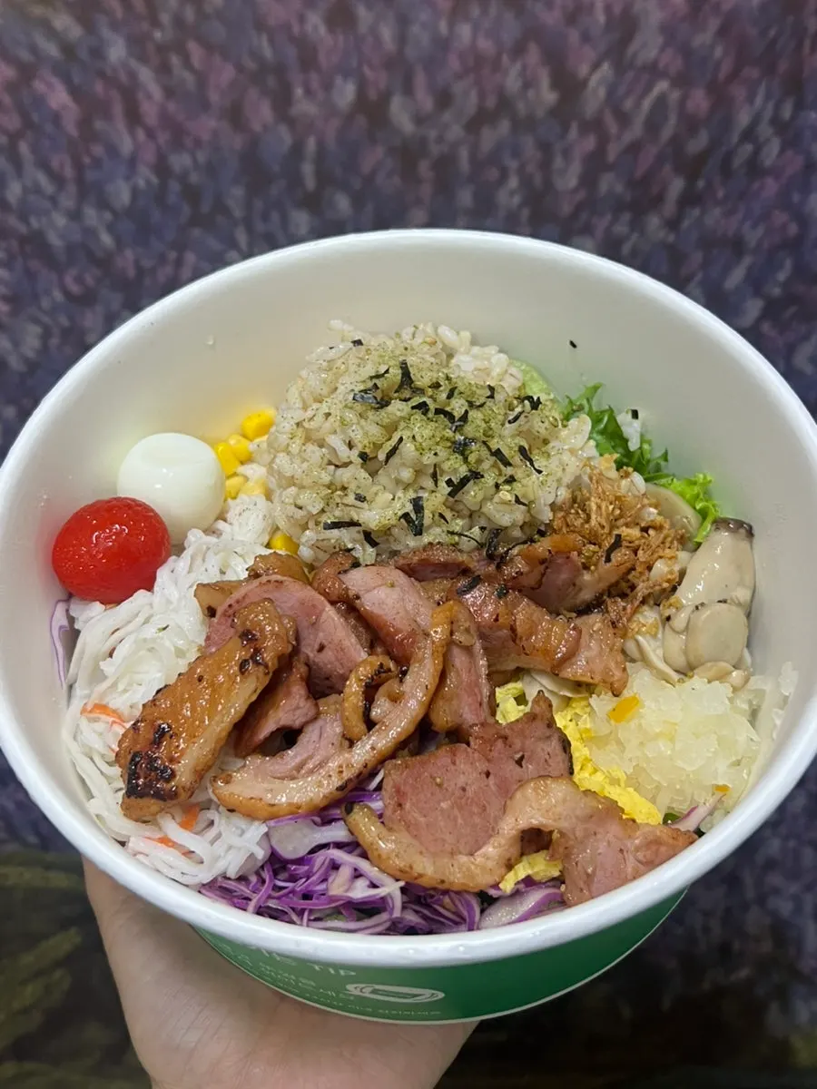 Takeout container of spicy sauce smoked duck poke