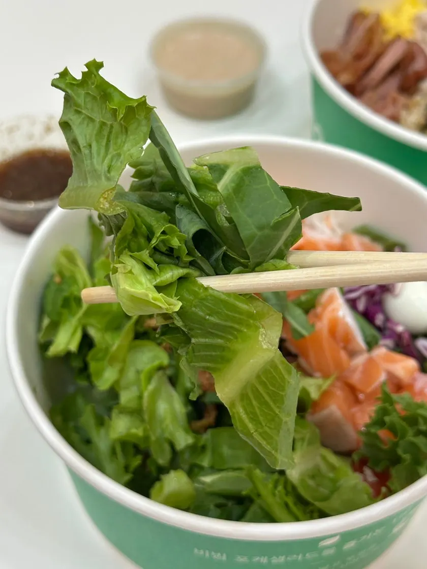 Two bibim poke bowls packed to go from Salering