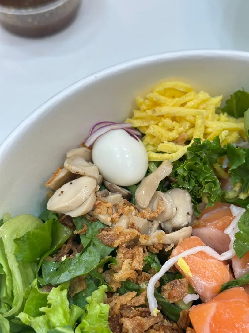 Poke bowl with egg strips and cherry tomatoes