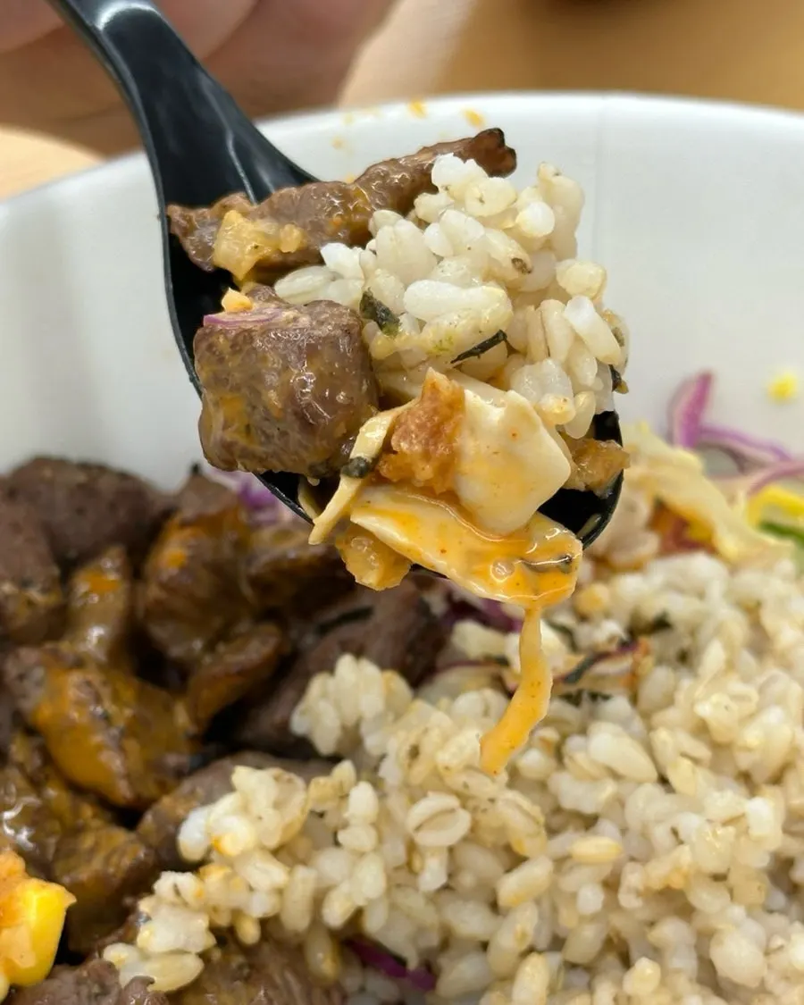 Bibim poke mixed with brown rice, barley, and meat