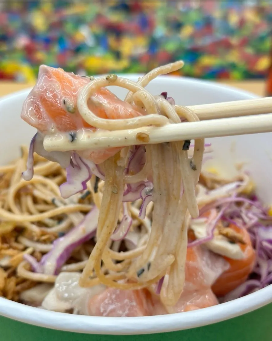 Raw salmon poke with a whole wheat pasta base