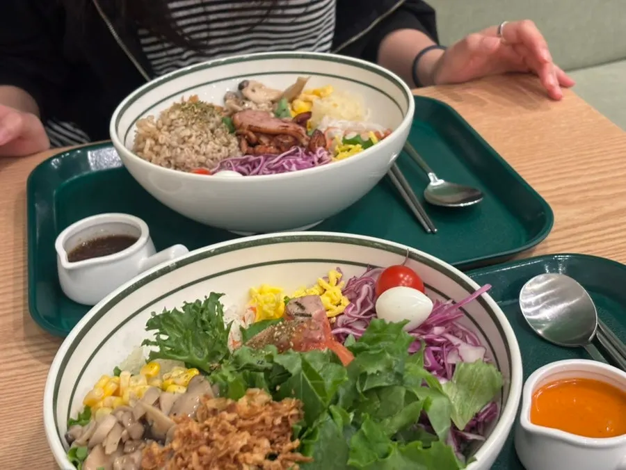 Smoked duck poke and salmon poke bowls side by side