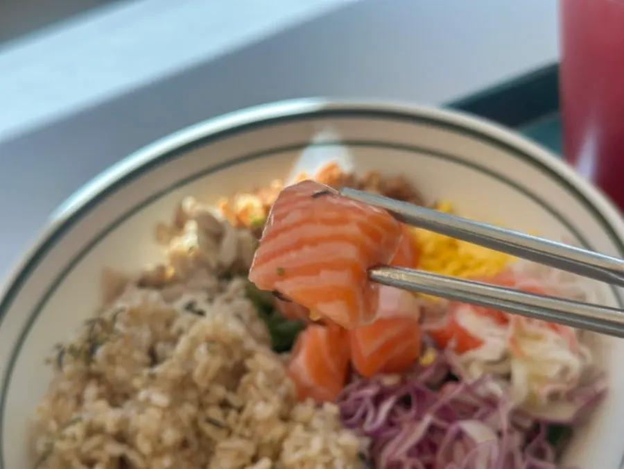 Raw salmon bibim poke with a brown rice base