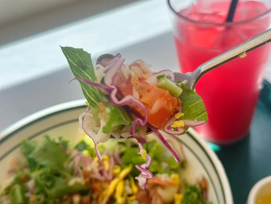 A spoonful of mixed salmon poke