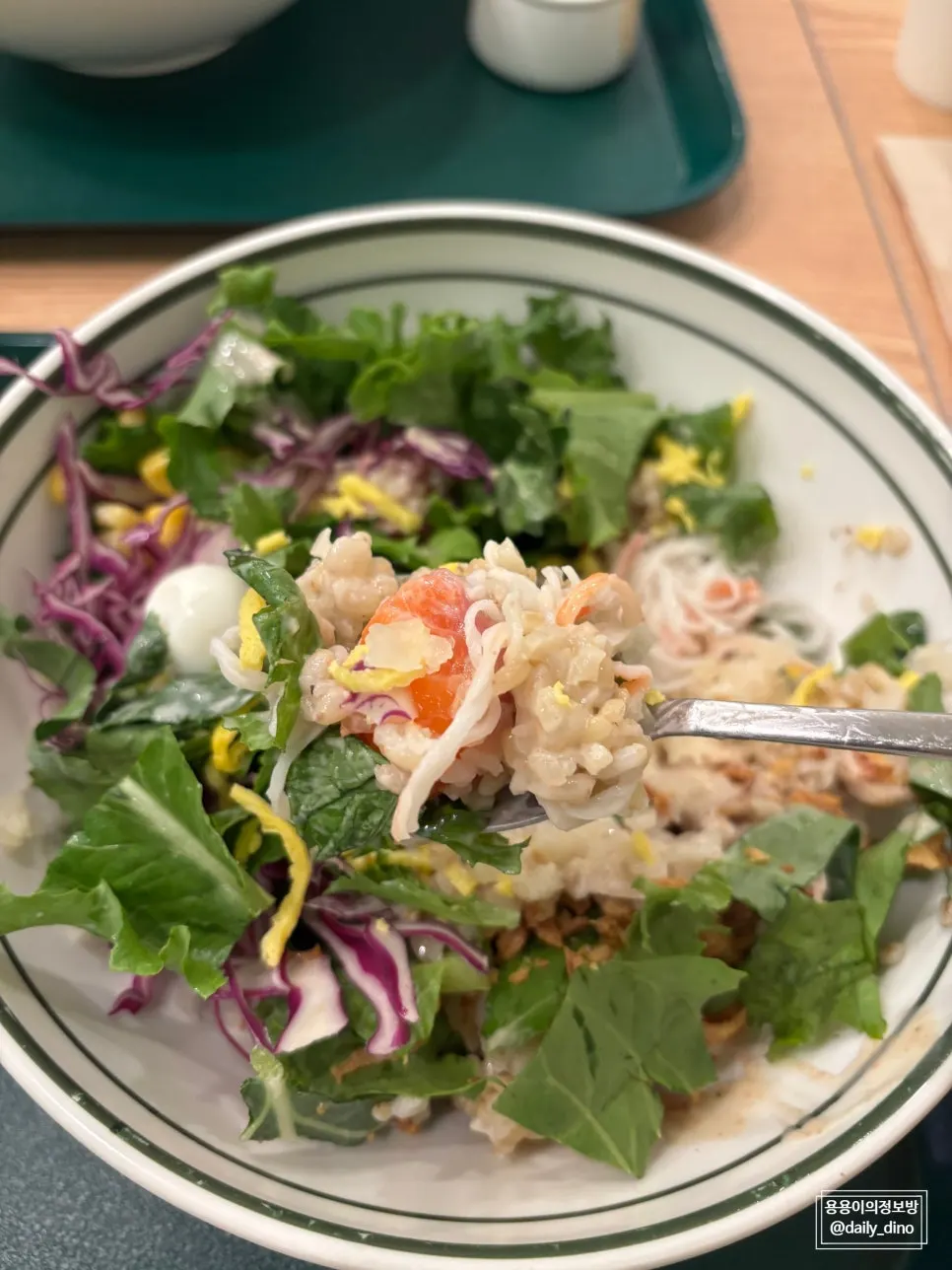 Drizzling wasabi mayo sauce over the salmon poke