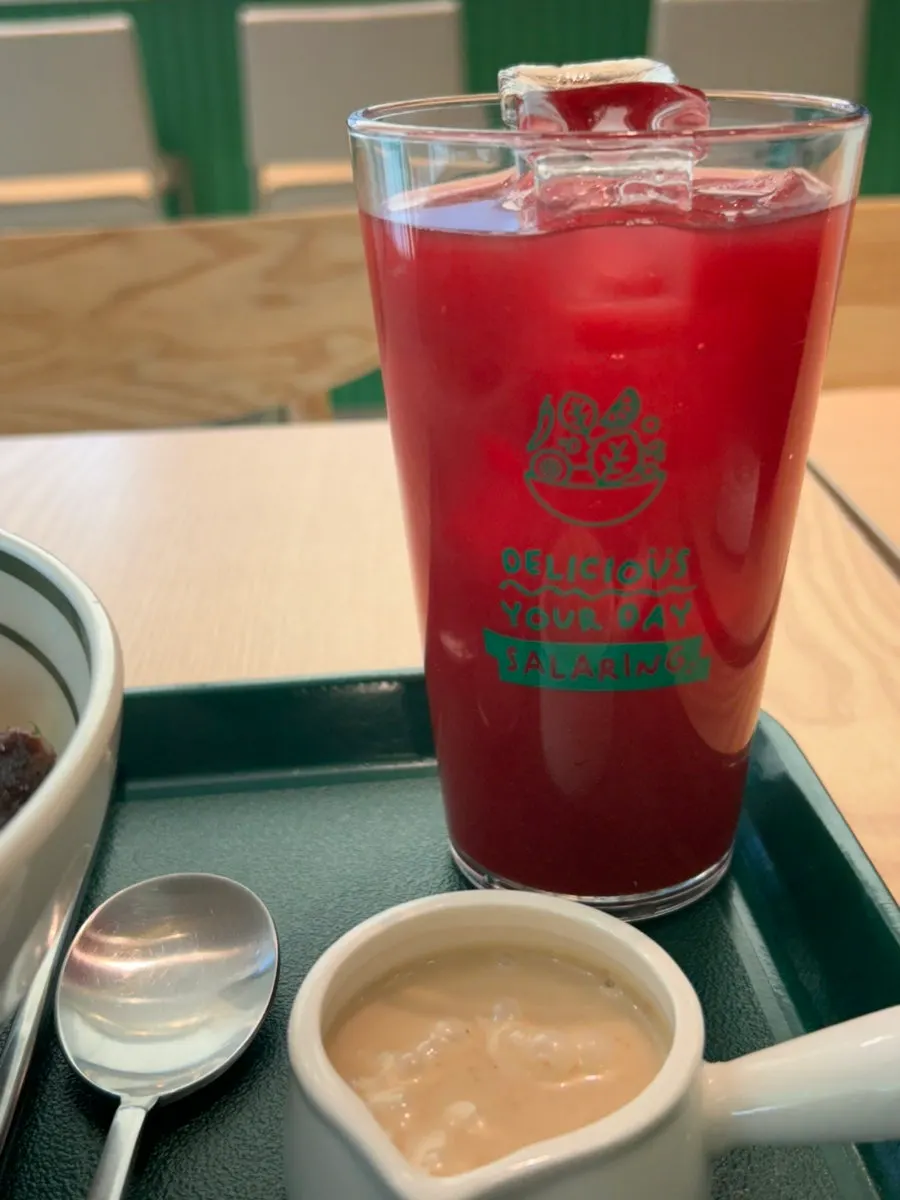 A glass of deep-colored ABC cleanse juice