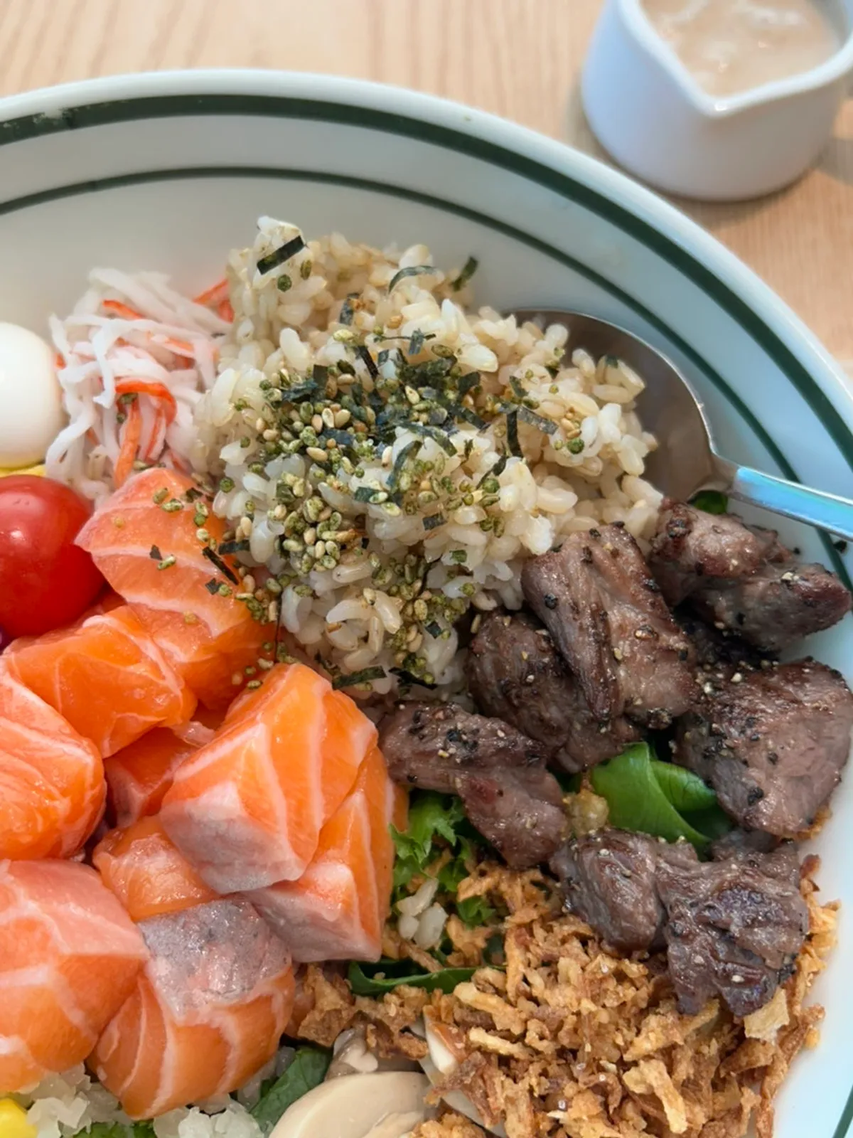 Close-up of poke with cabbage, cherry tomatoes, and quail eggs