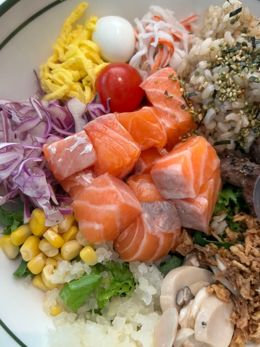 Picking up poke ingredients with a fork