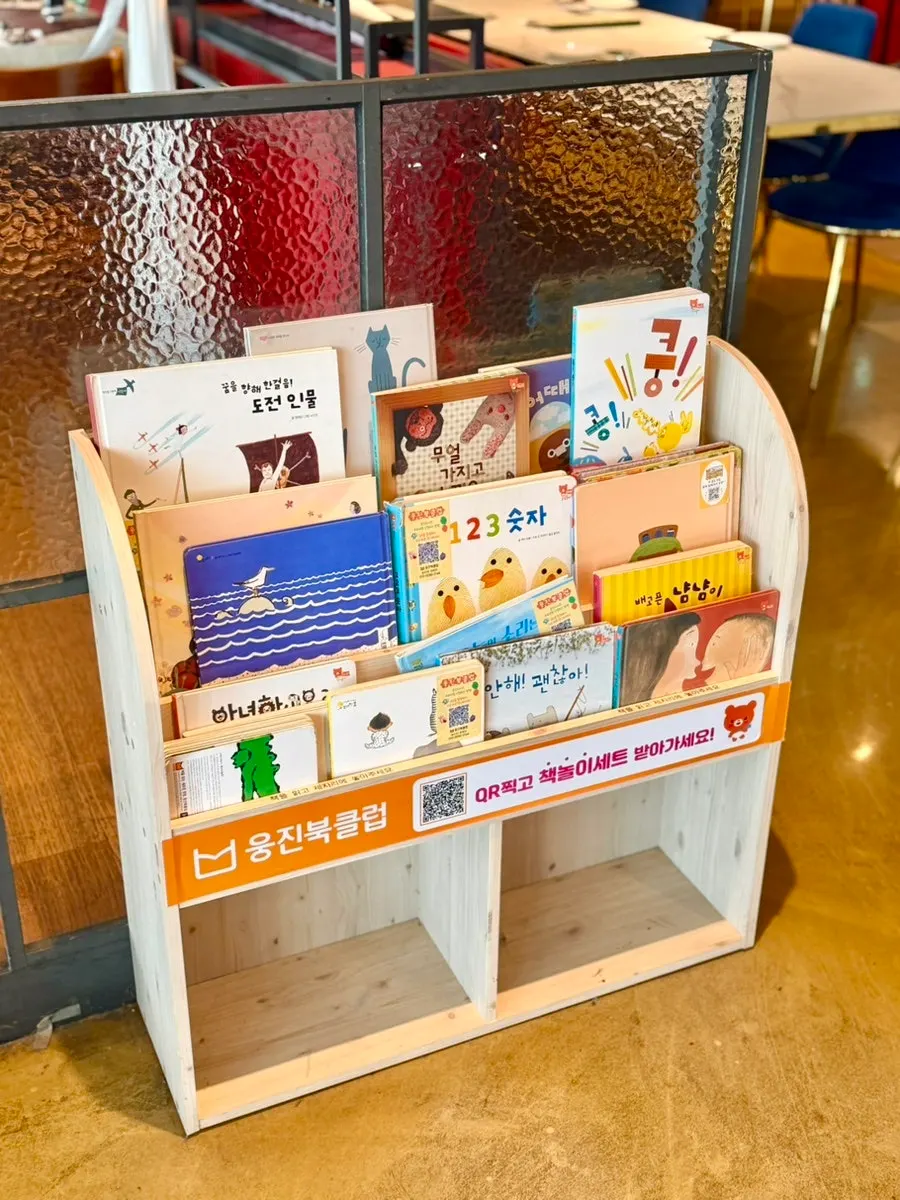 Children's bookshelf displayed on one side of the restaurant