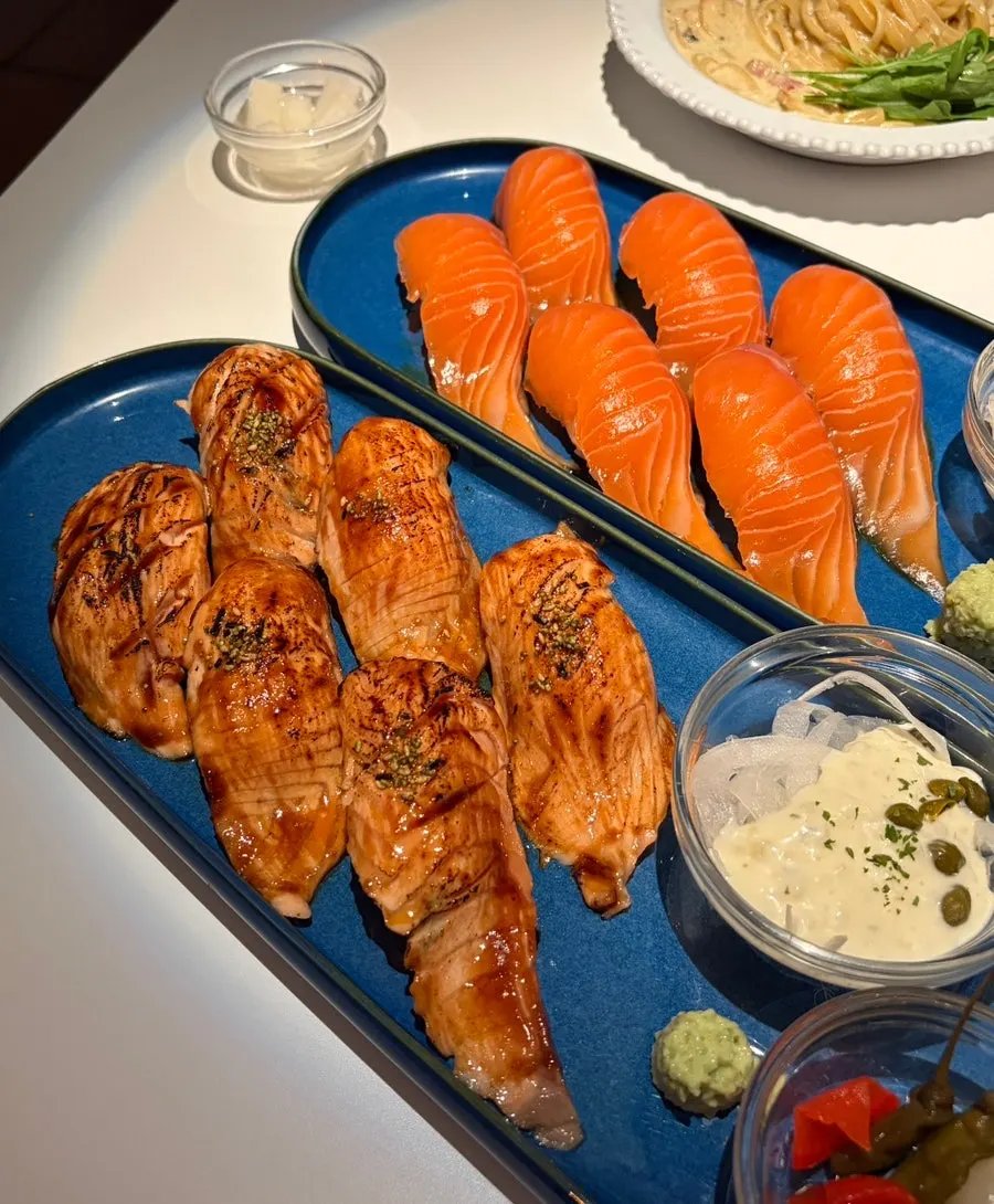 Close-up of a plate of salmon sushi at Salmon Brothers
