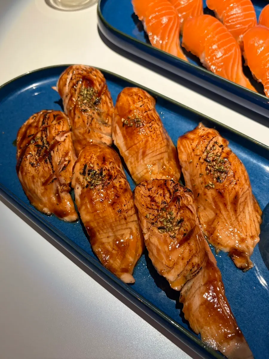 Raw salmon tataki sushi with a seared surface