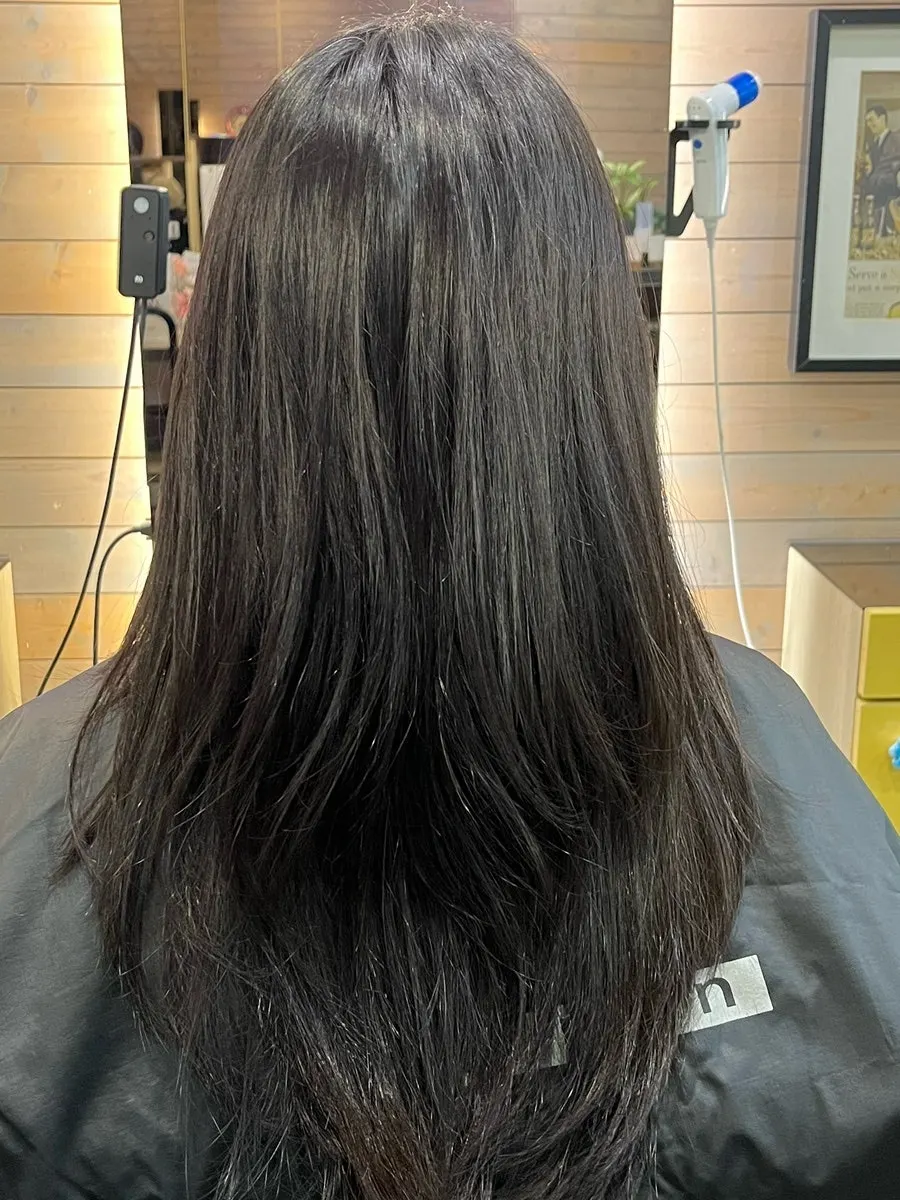 Close-up of frizzy hair ends before treatment
