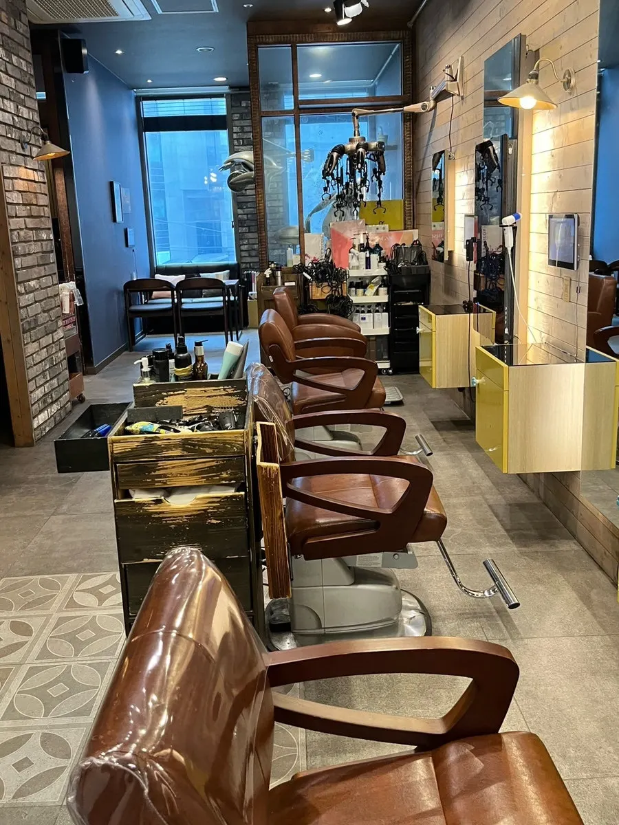 Treatment space at Salon de L with wood-tone interior