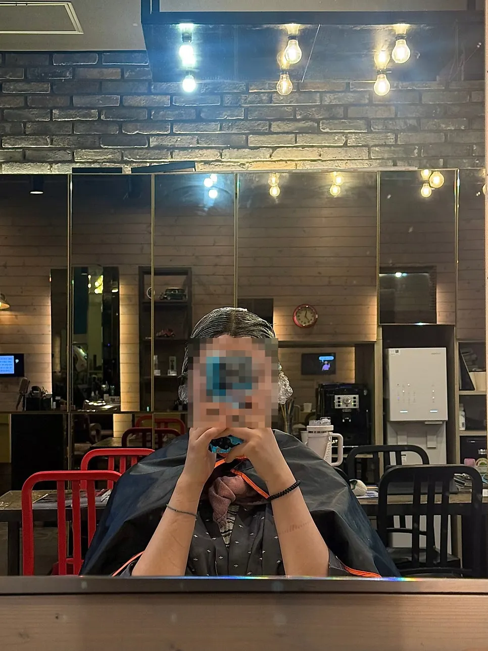 TV playing hair care tips during the wait