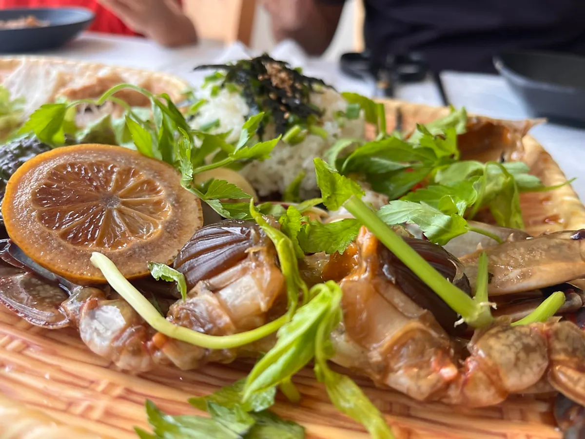 Gejang served together with rice