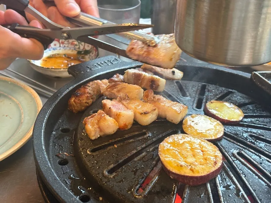 Different pork cuts grilling on the pan