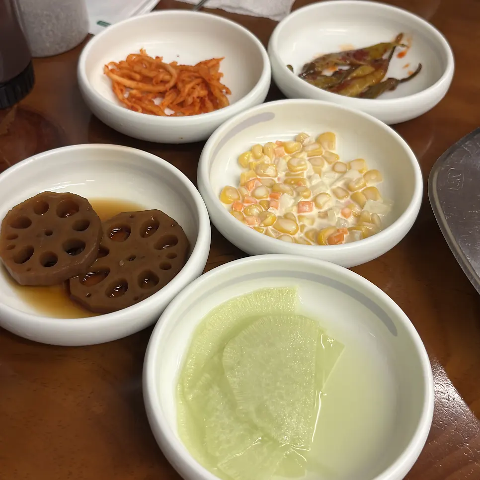 Side dish spread with braised lotus root and radish salad