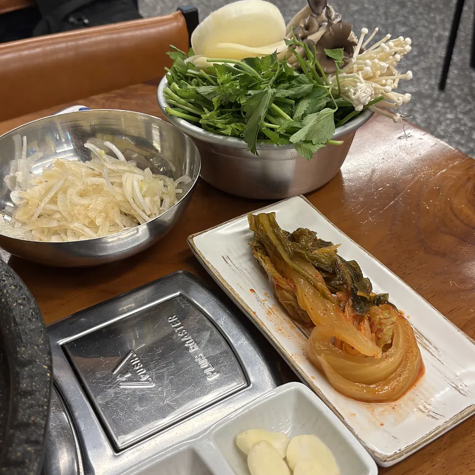 Side dish plates with pickled peppers and corn salad