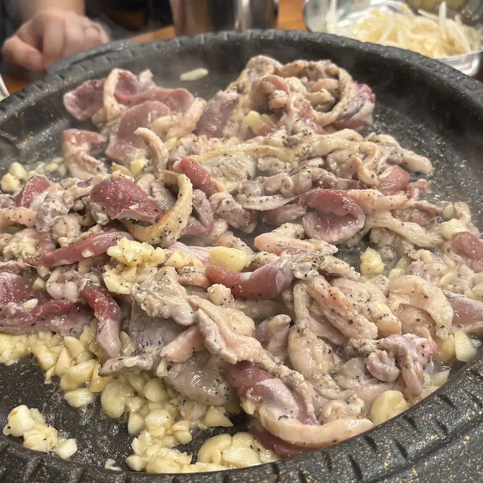Close-up of raw duck loin and garlic before grilling