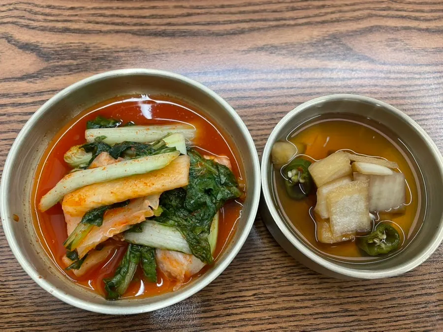 House-made kimchi and pickled onion side dishes