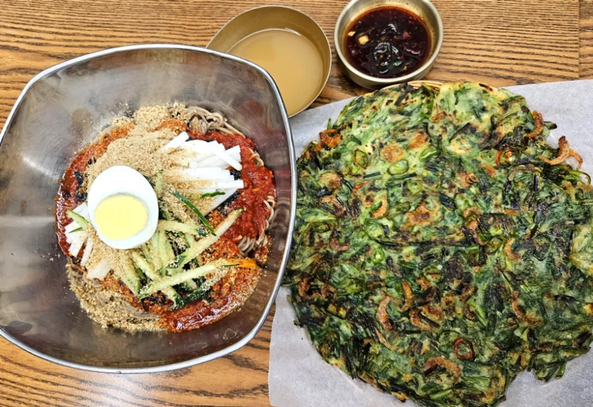 Bibim makguksu and buchujeon table setting at Samiri Makguksu Migeum Branch