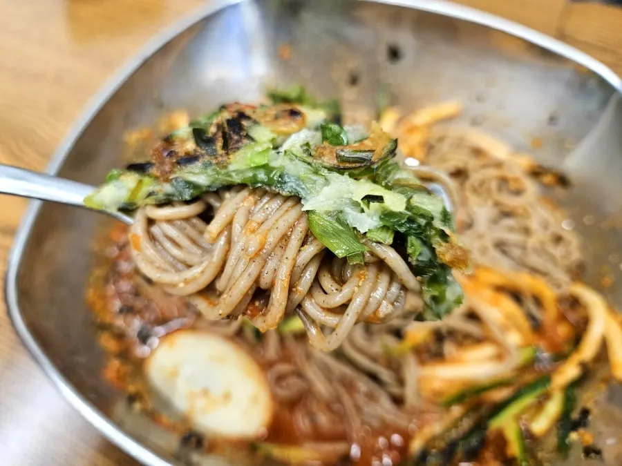 Table with both bibim makguksu and buchujeon together
