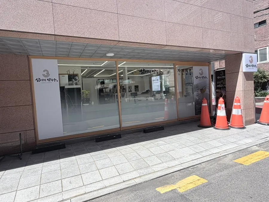 A car parked in front of the store