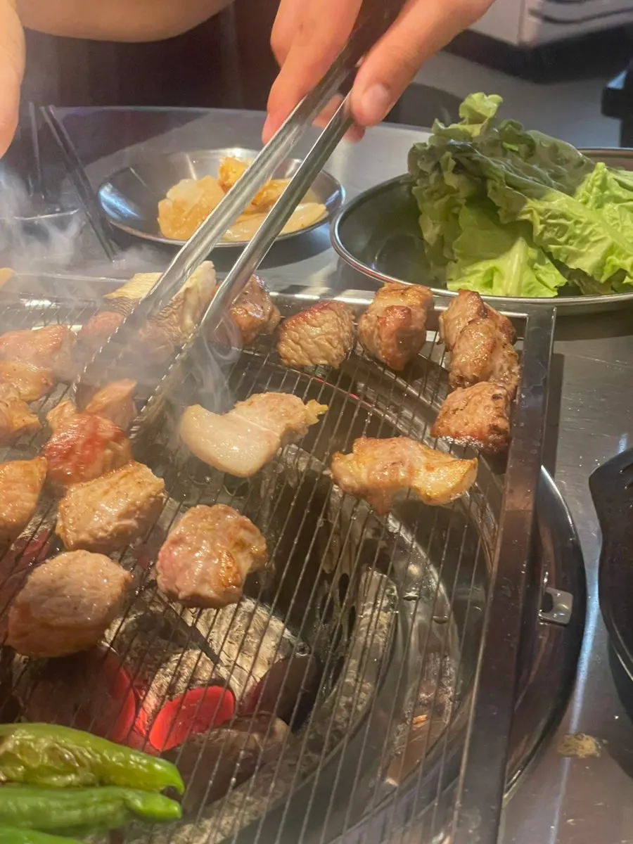 Grilled pork neck dipped in salt
