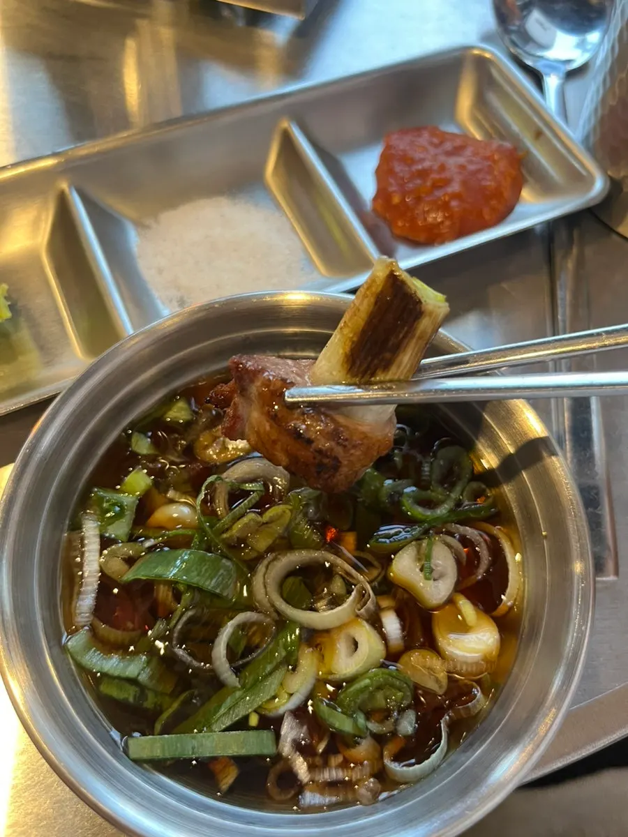 Sammokjip's scallion sauce served instead of pickled onions