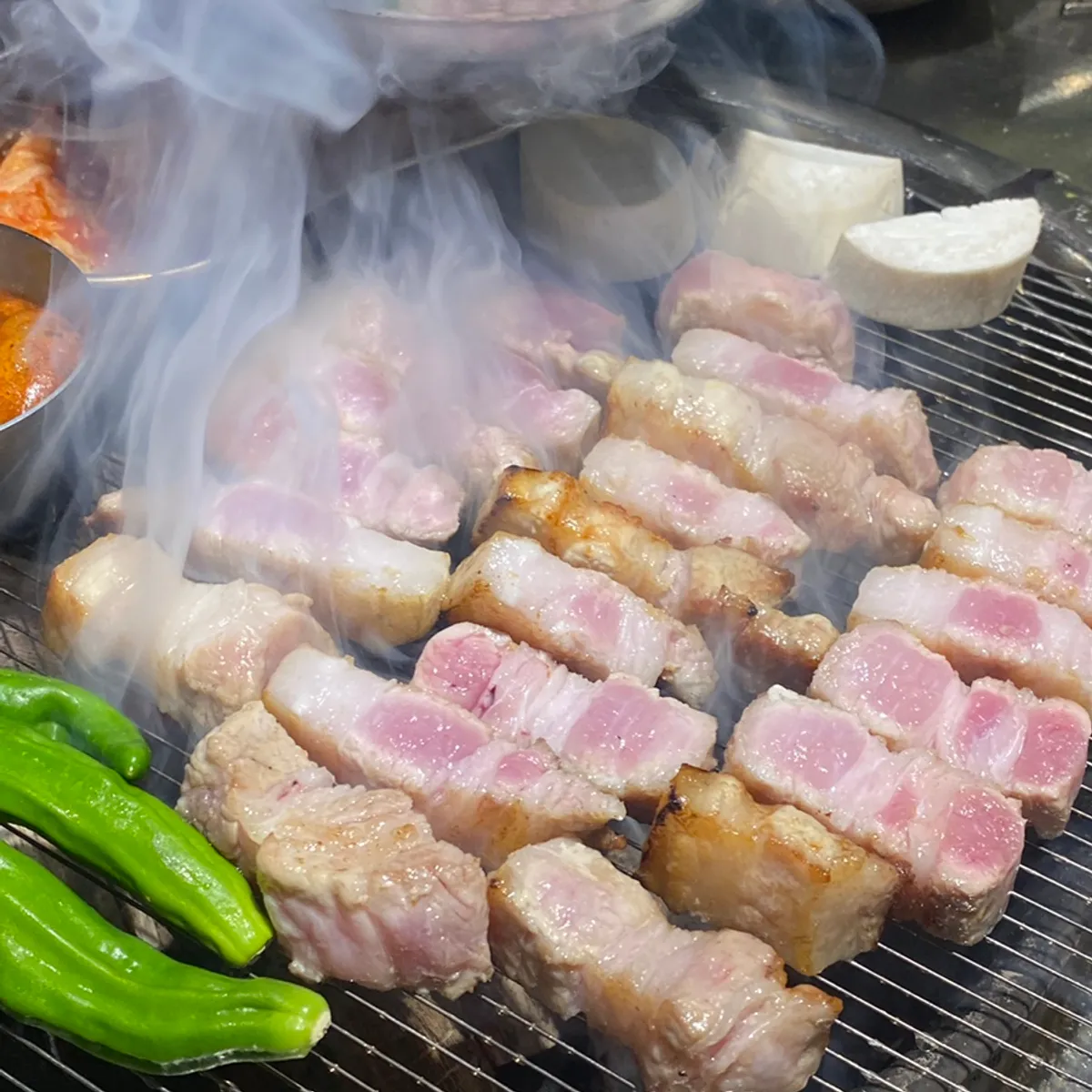 Two servings of thick-cut raw pork belly