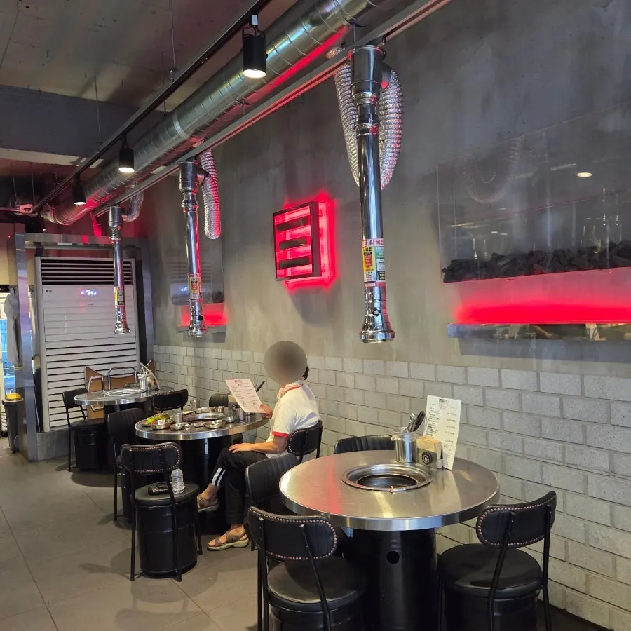 Interior of Snug Roastery with round tables