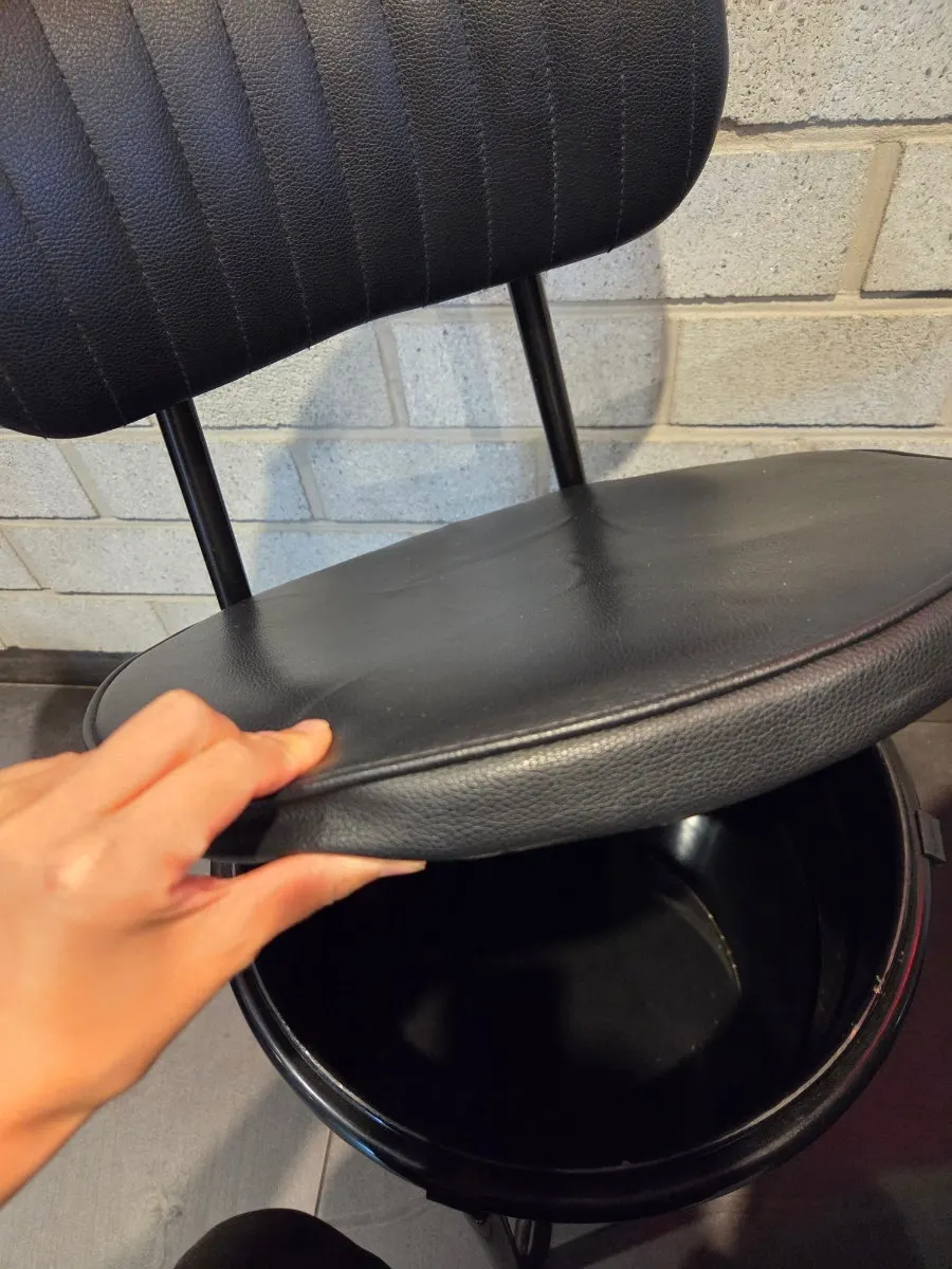 Storage space under the chairs for bags