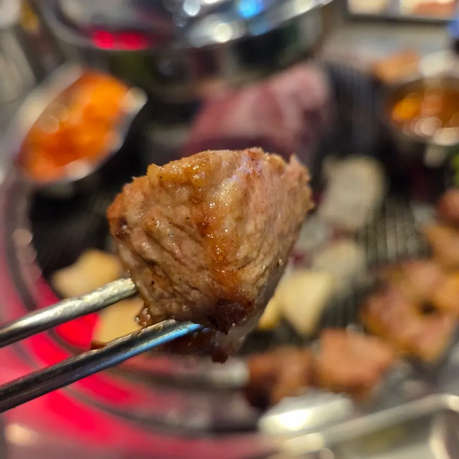 Teukmokssal cooking quickly over the charcoal grill