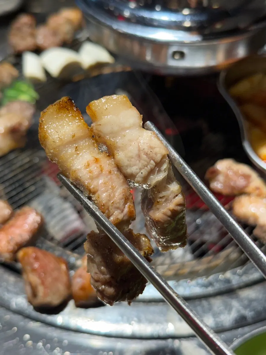 Grilled pork wrapped in a lettuce leaf