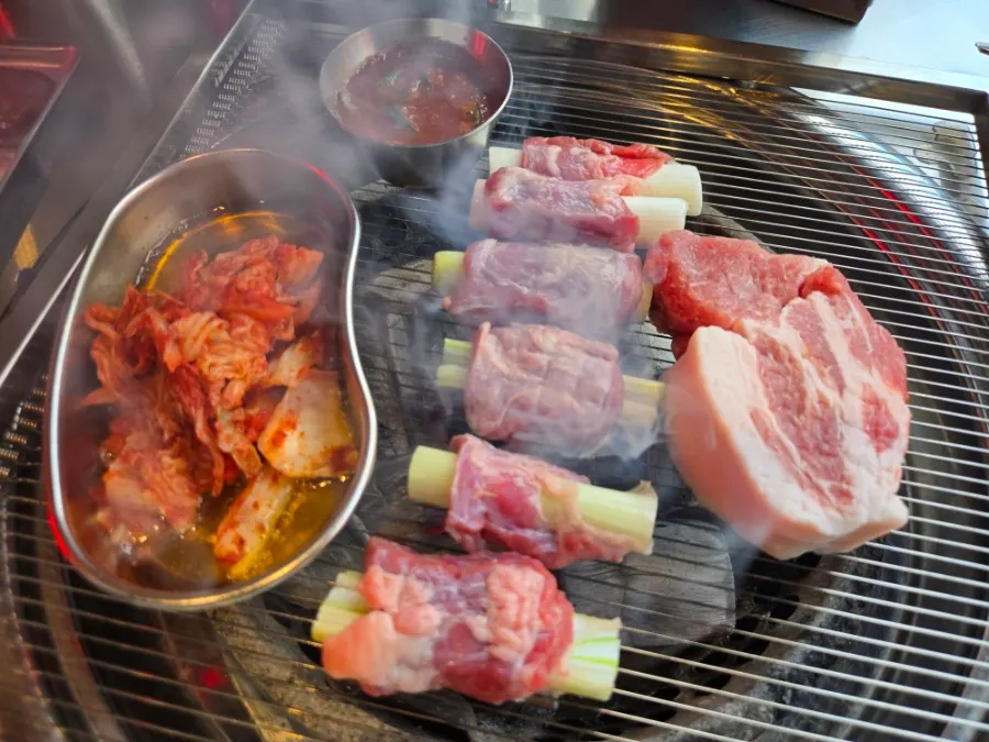 Whole-scallion galmaegisal cooking over charcoal