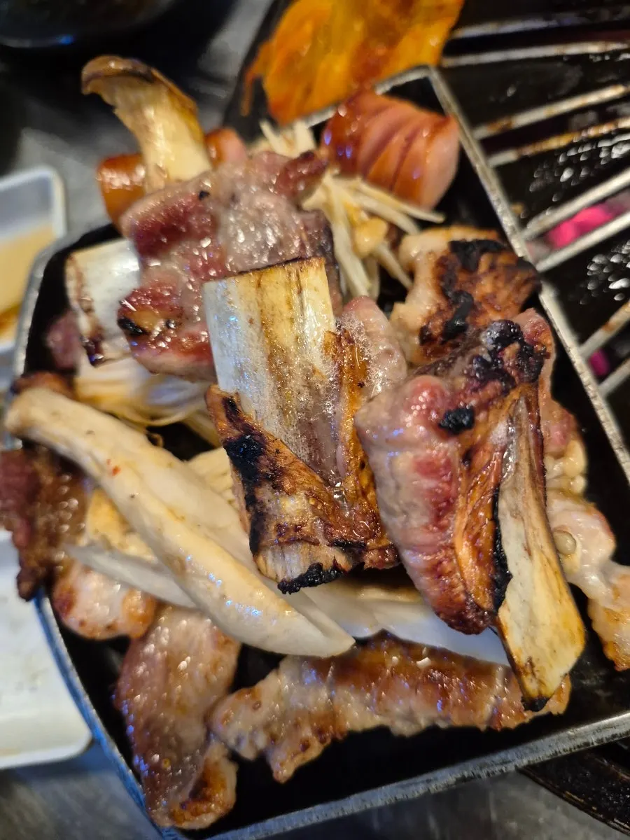 Grilled meat plated with lettuce wraps