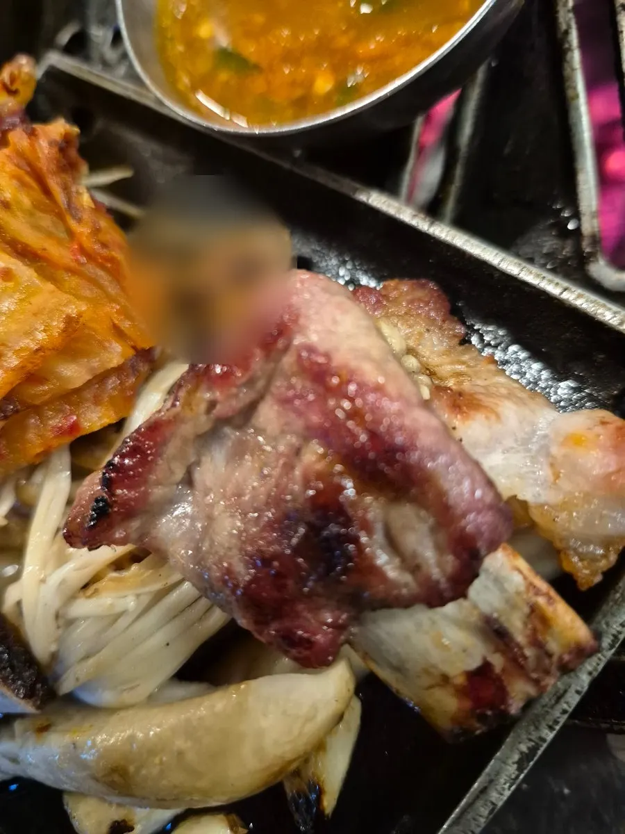 Black pork raw ribs dipped in the house meat sauce