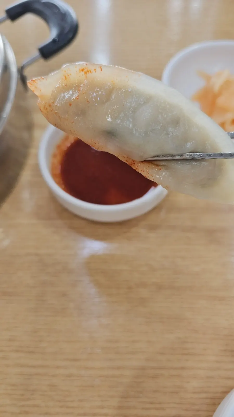 Steamed dumplings dipped in sauce